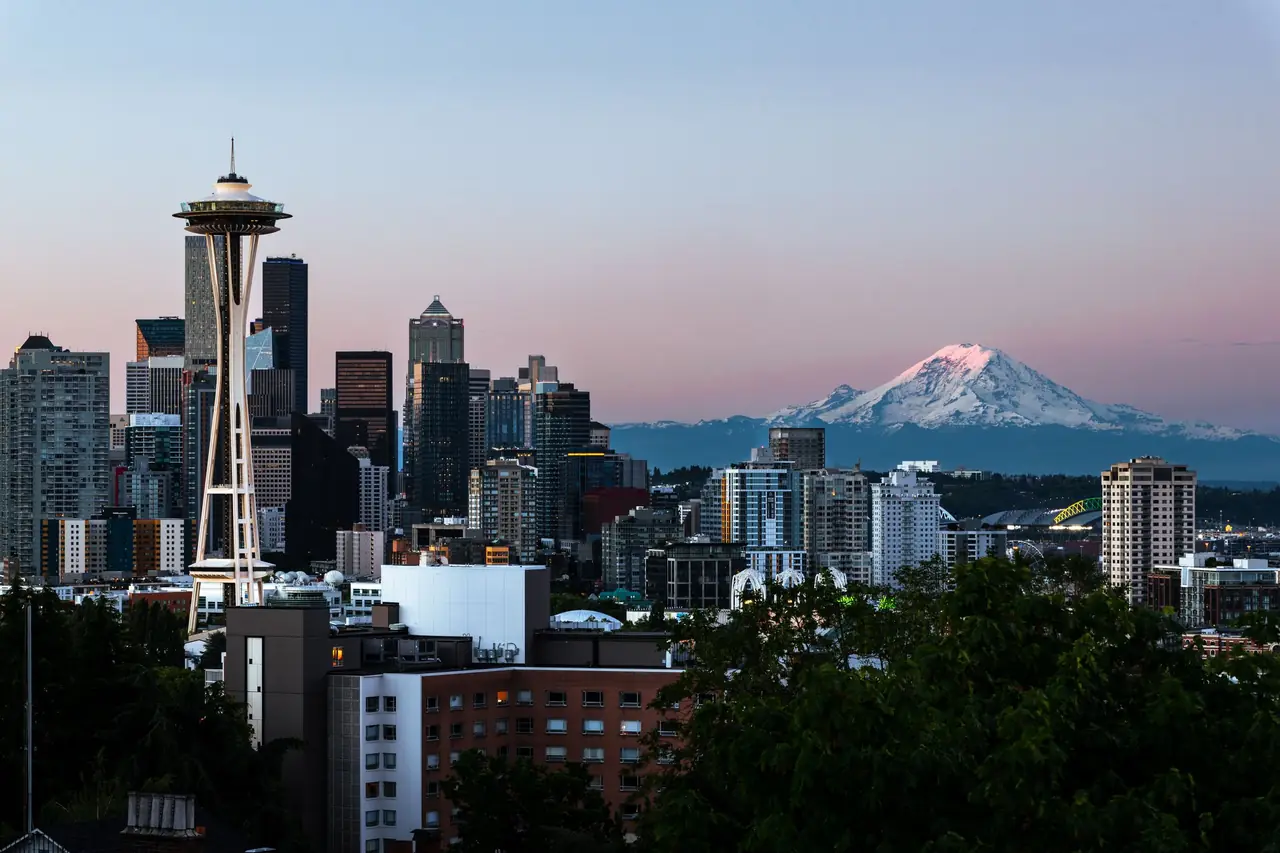 Seattle skyline from Kerry Park with the Space Needle and snow-capped Mount Rainier at sunset
